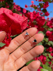 Blue Sapphire and Diamond Necklace held in hand