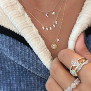 Mini Moon and Star Necklace on model