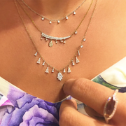 Diamond bezel necklace layered on model