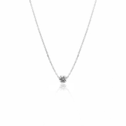 Solitaire diamond necklaces layered on model