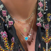 Signature Off Center Disk Necklace layered on model