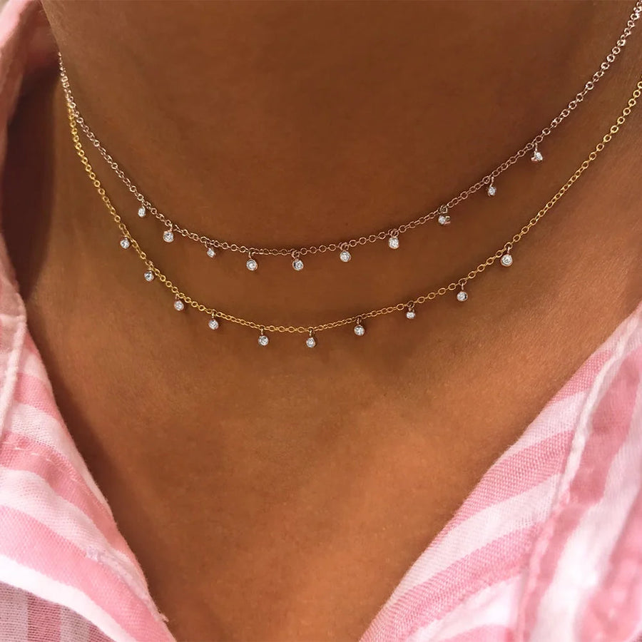 Diamond bezel chokers layered on model